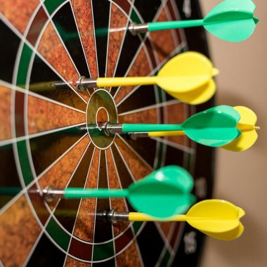 Green and Yellow Darts on Brown-black-green-and-red Dartboard