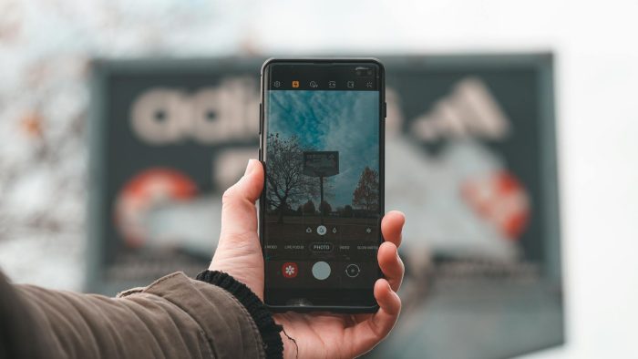 Person Holding Black Android Smartphone